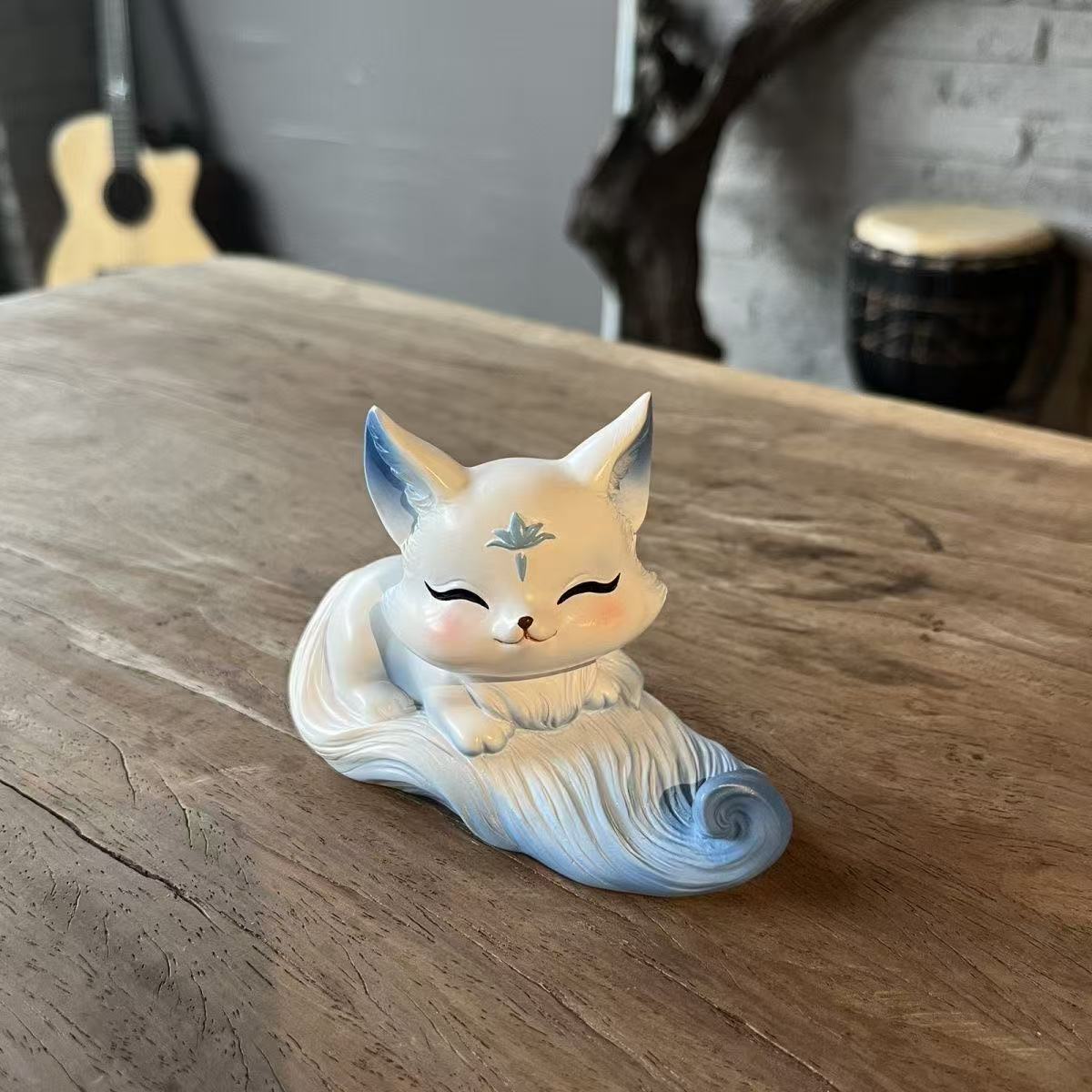 Cute Little Fox Decoration Phone Holder. It's a home decoration item with a cute style. It's a genuine new product in the Chinese style for indoor use.