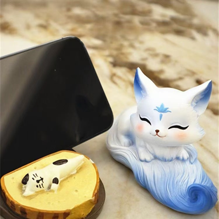 Cute Little Fox Decoration Phone Holder. It's a home decoration item with a cute style. It's a genuine new product in the Chinese style for indoor use.