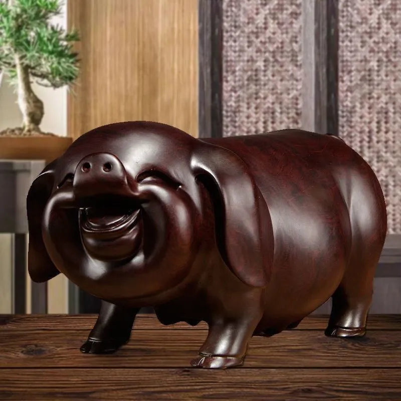 Pear wood carving of the pig, redwood and ebony wood carvings of the pig among the twelve Chinese zodiac animals for attracting wealth. They are tabletop birthday gifts, the lucky golden pig ornaments.