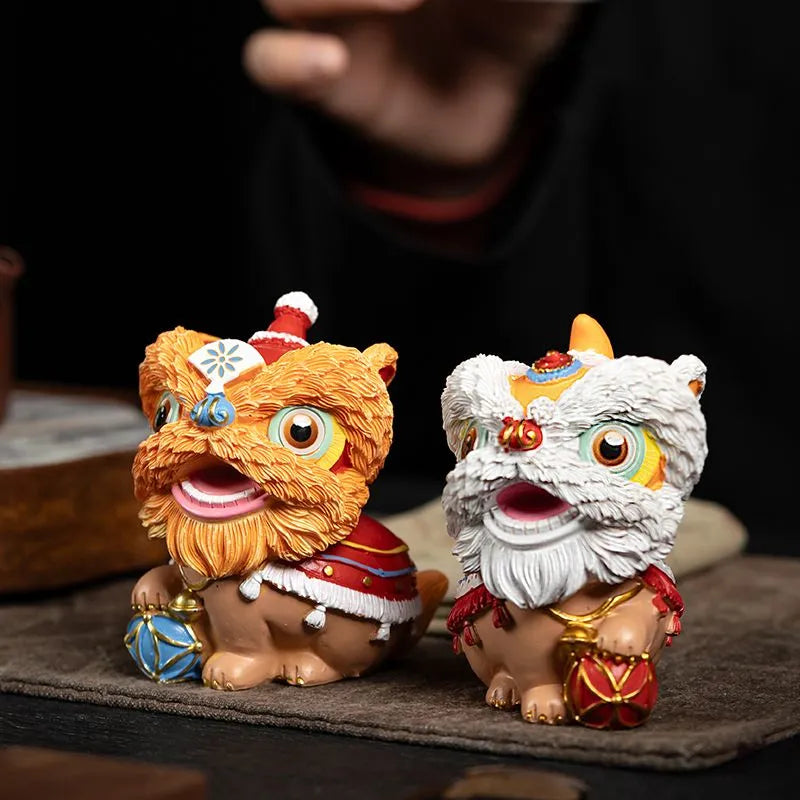 The new Chinese trendy resin tea pet of waking lion, Forbidden City fortune-telling tea tray ornament, desktop and living room cultural and creative lion dance entrance decoration.