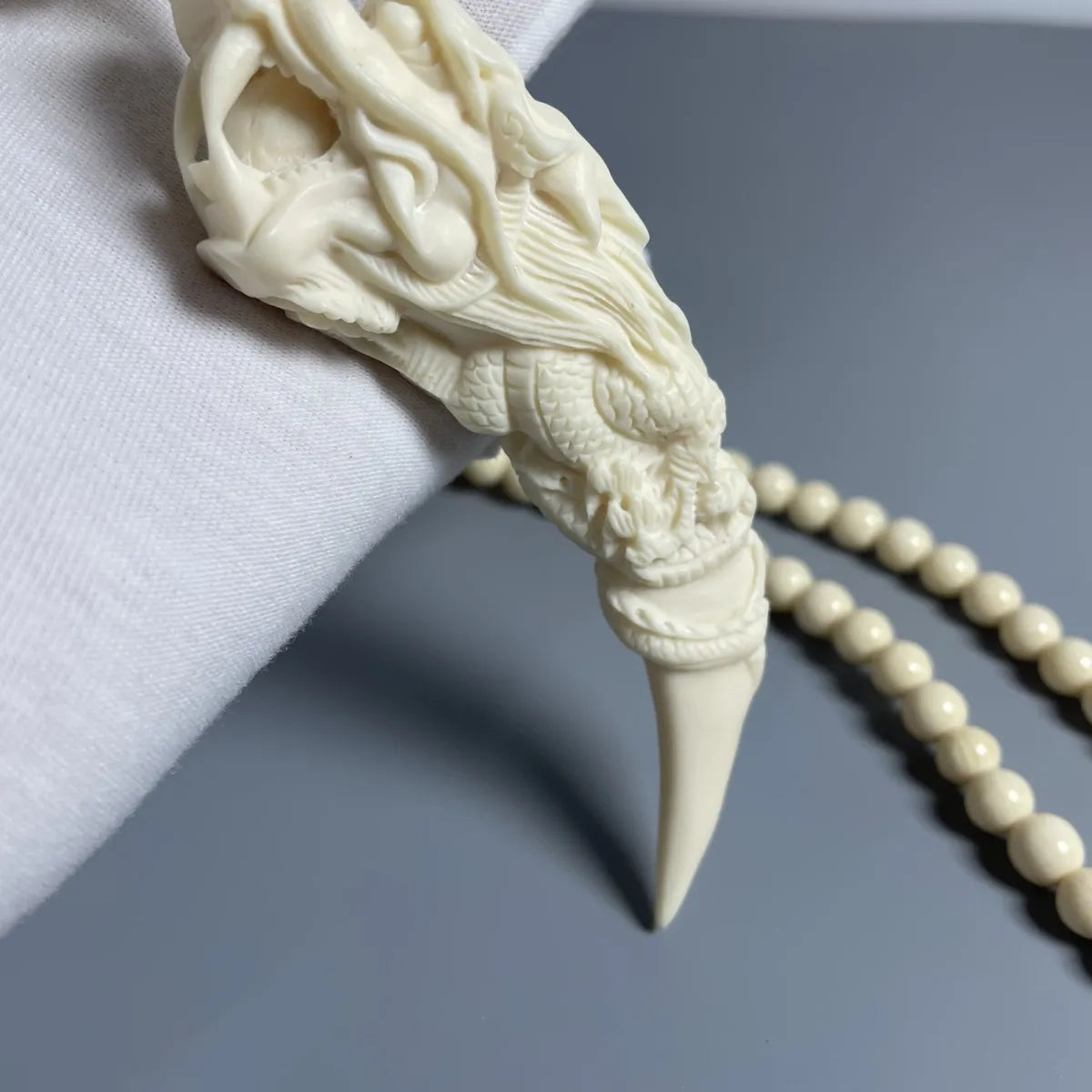 Mammoth Ivory - carved Dragon Tooth Pendants, made from mammoth tusk tips. These