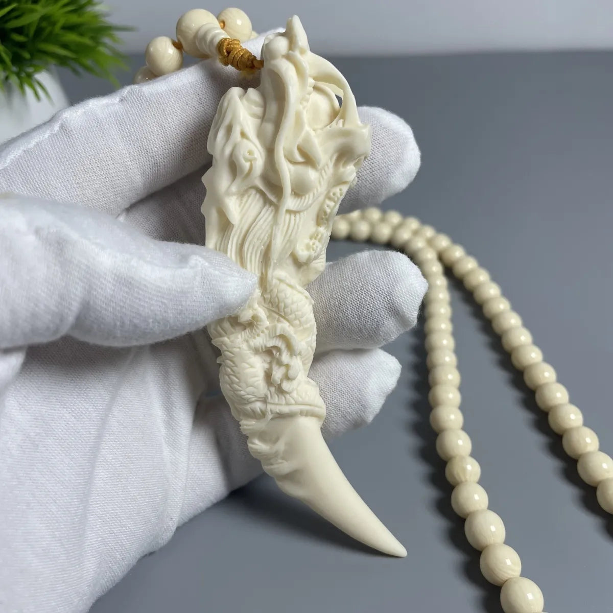 Mammoth Ivory - carved Dragon Tooth Pendants, made from mammoth tusk tips. These