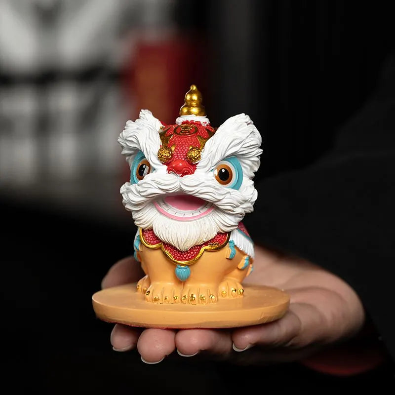 The new Chinese trendy resin tea pet of waking lion, Forbidden City fortune-telling tea tray ornament, desktop and living room cultural and creative lion dance entrance decoration.