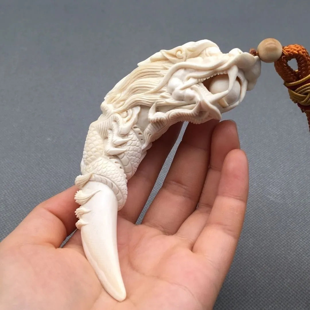 Mammoth Ivory - carved Dragon Tooth Pendants, made from mammoth tusk tips. These