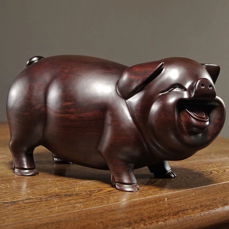 Pear wood carving of the pig, redwood and ebony wood carvings of the pig among the twelve Chinese zodiac animals for attracting wealth. They are tabletop birthday gifts, the lucky golden pig ornaments.
